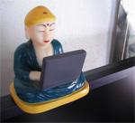 Our squeaky Buddha working on laptop